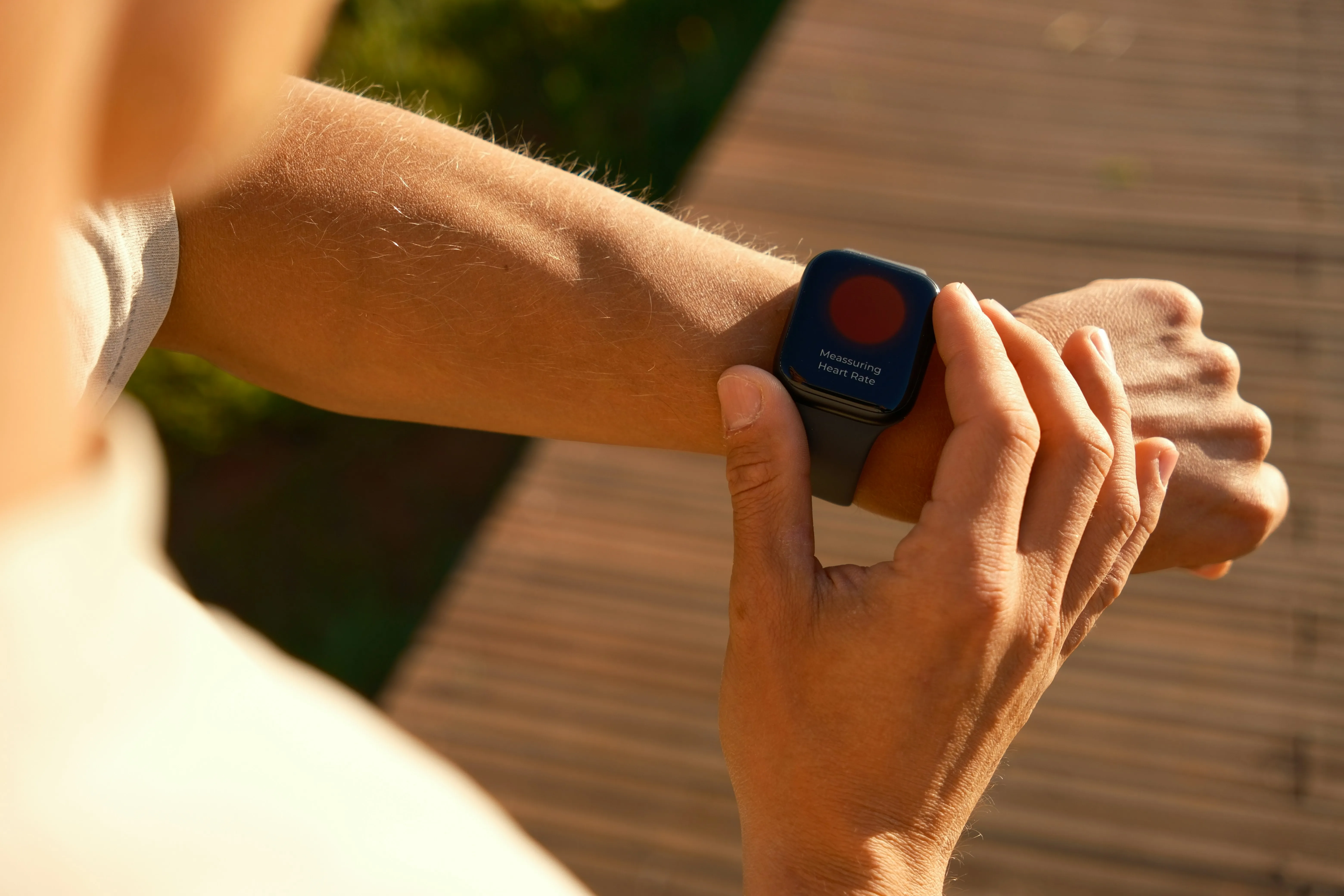 Close-up of a smartwatch displaying fitness tracking data on a wrist