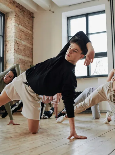 Breakdancers practicing in a loft studio