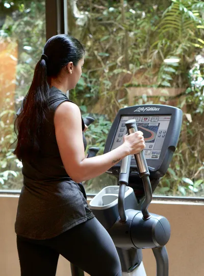 Woman using an elliptical machine