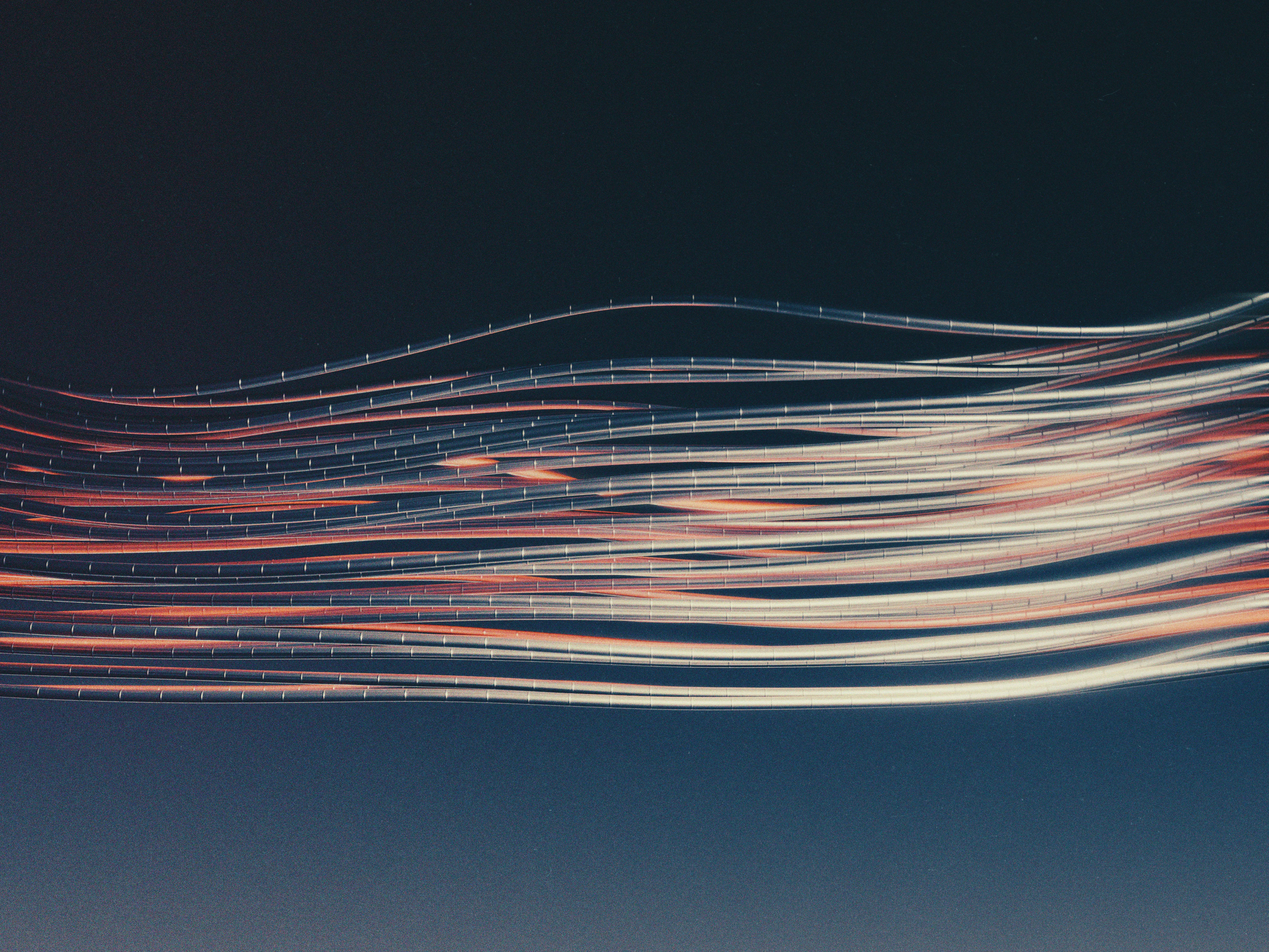 Abstract light trails flowing like data streams, representing the momentum of tracking progress over time